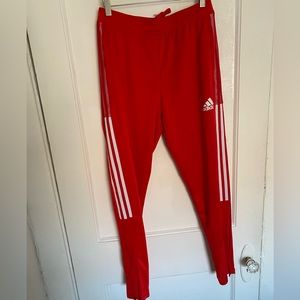 Red adidas track pants